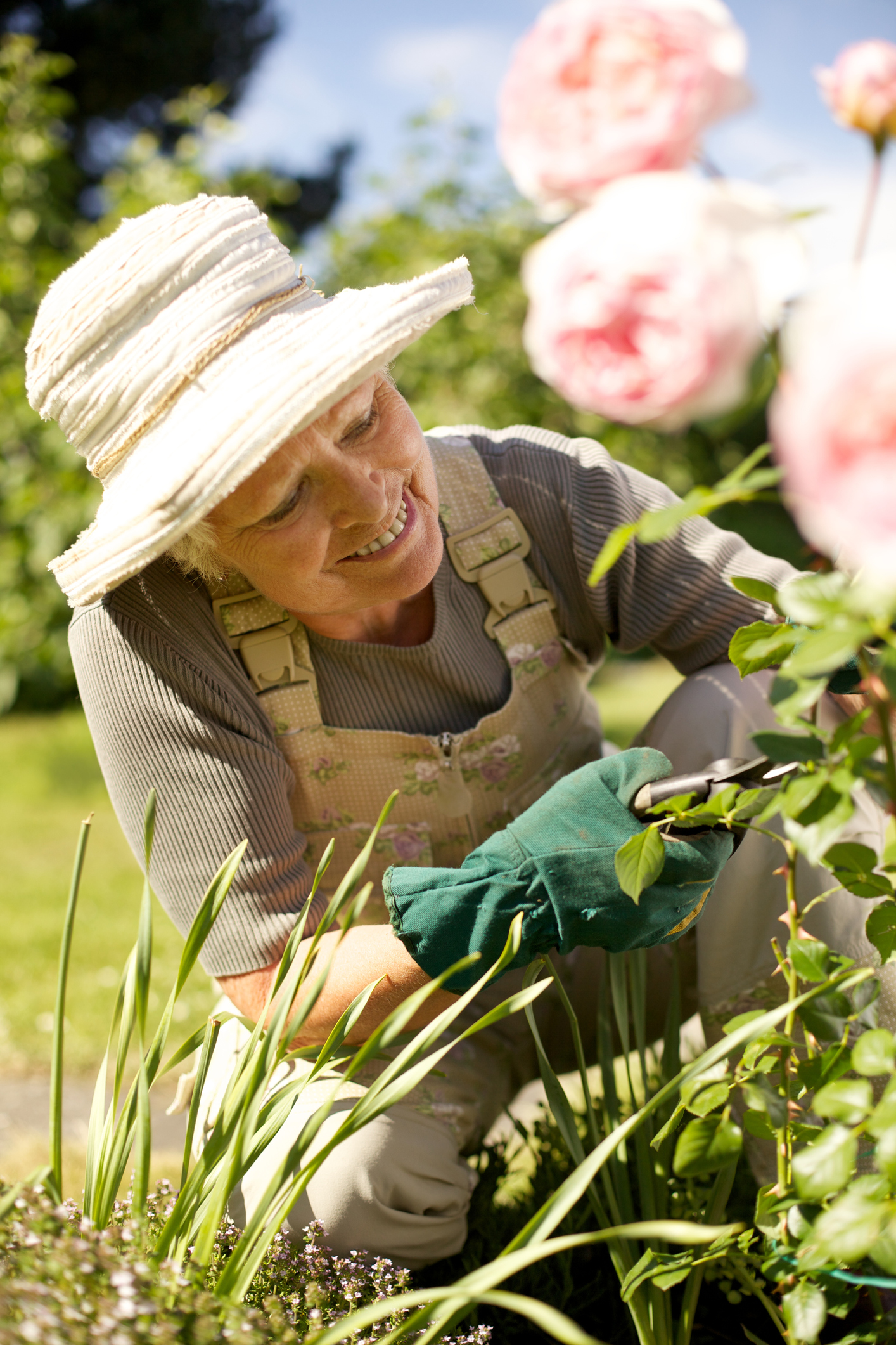 Senior woman fixing up her garden